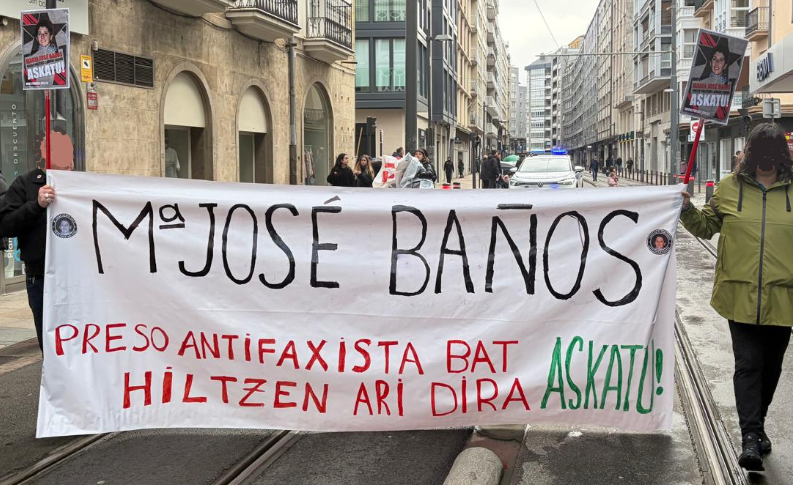 Pancarta solidaria en una manifestación 